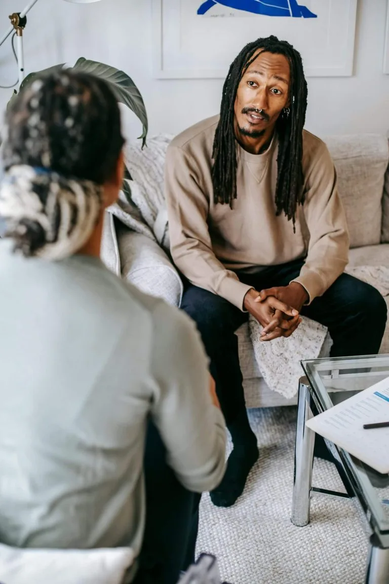 Two people in conversation during a counselling session