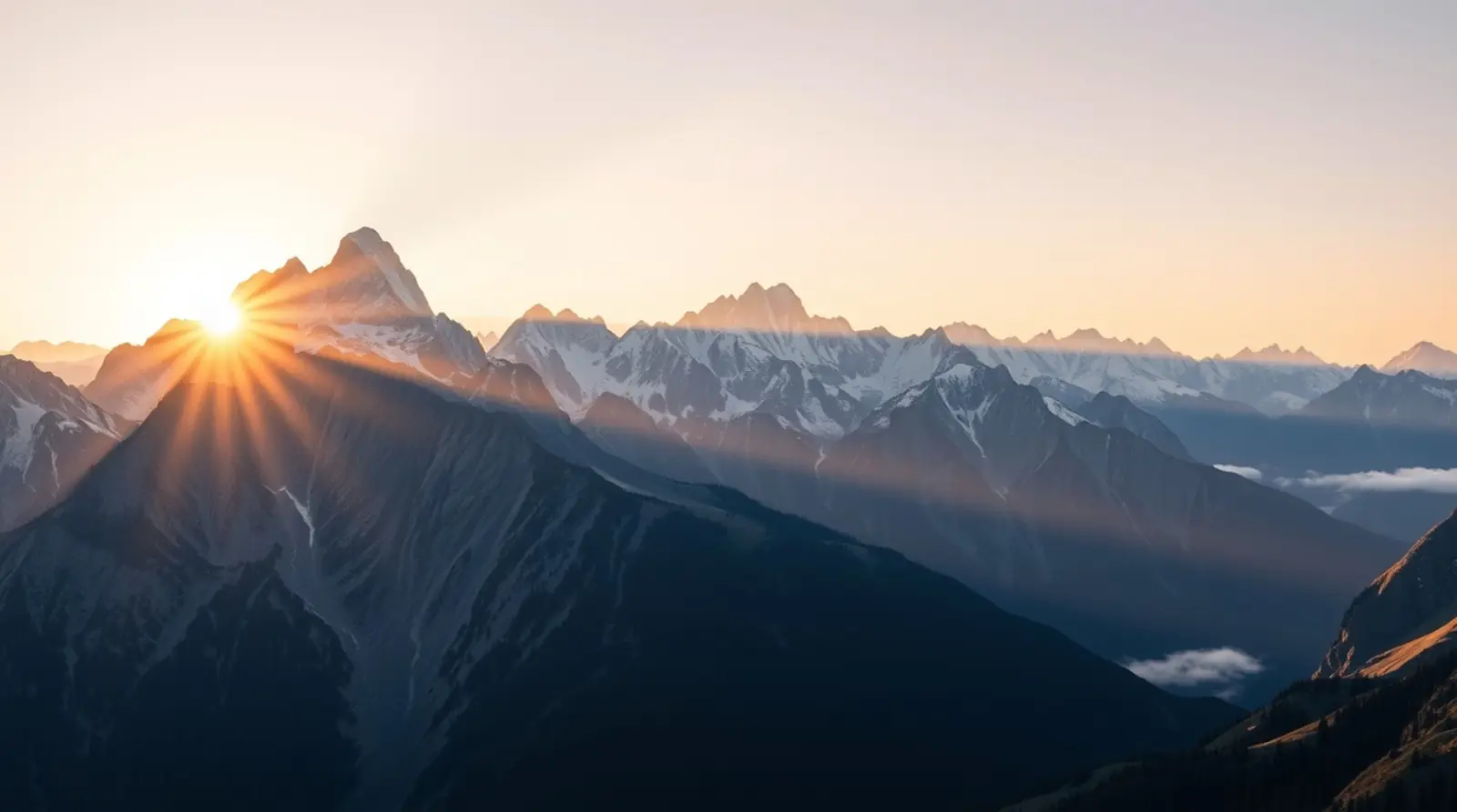 Sunrise over a rugged mountain summit